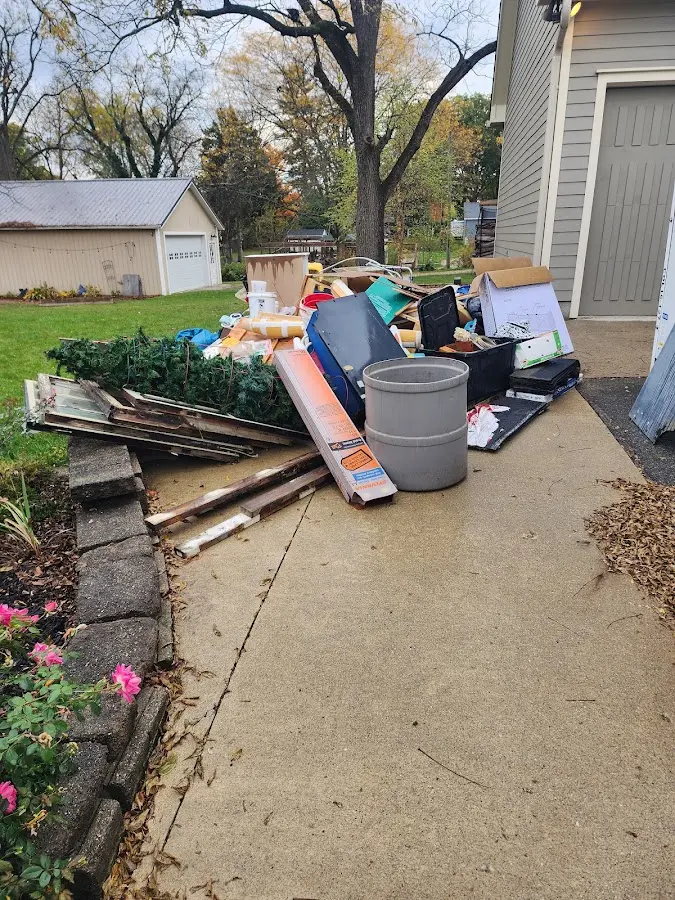 Dumpster being loaded with debris for Commercial Dumpster Rental in Alexandria